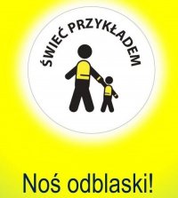 Na zdjęciu sylwetka osoby dorosłej i dziecka noszących odblaski.