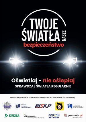 Na zdjęciu plakat promujący akcję &quot;Twoje światła - Nasze bezpieczeństwo&quot;, samochód widziany w nocy z przodu , z włączonymi światłami.